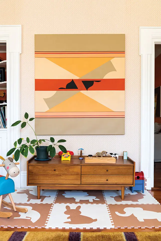 The kids play area featuring an acrylic by Tim Van Campen