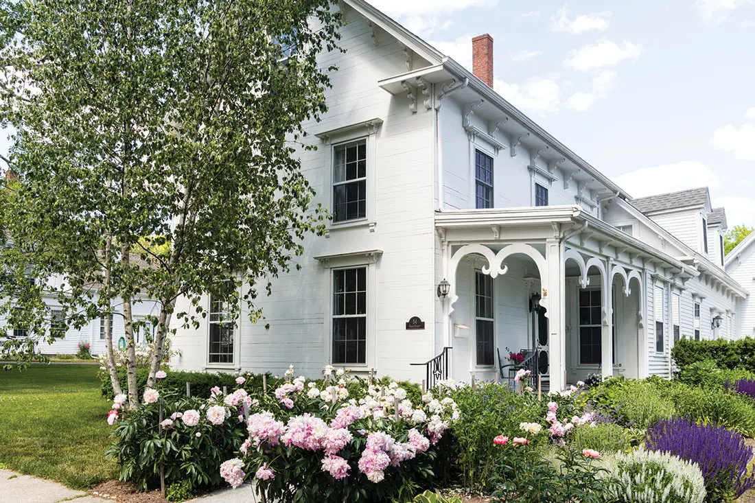 The front porch’s inverted fleur-de-lis are a signature flourish of architect James Overlock