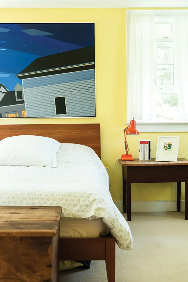 Greta Van Campen and Mike Silverstein's bedroom featuring Van Campen's artwork