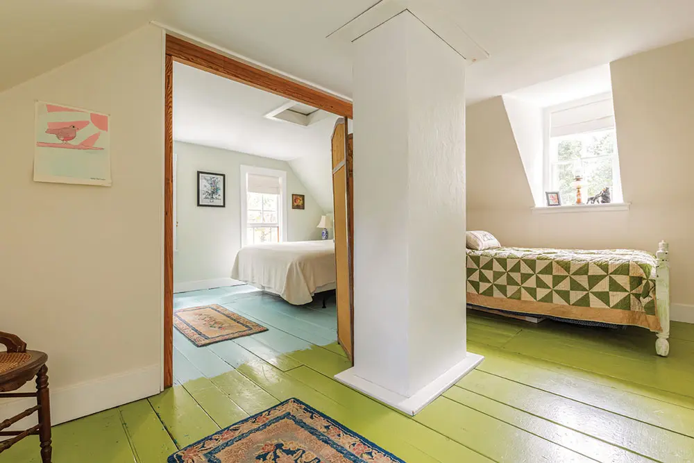 upstairs are guest rooms, one with a chartreuse-painted floor and ivory wall paint, the other with sky-blue and mint-green paint on the floor and walls.