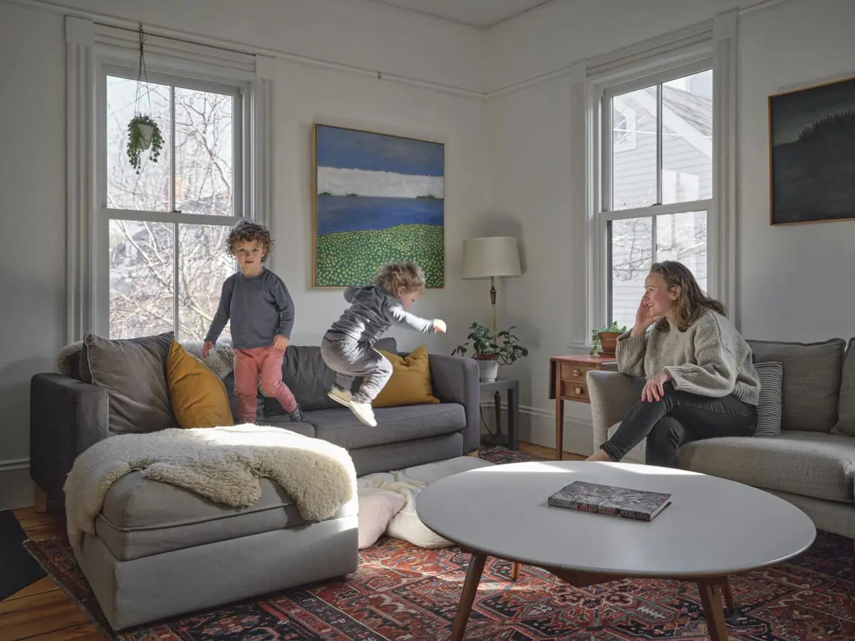 a nine-and-a-half-foot ceiling, large south-facing windows, and, unlike much of the house, decorative trim in the living room of the suspected former boarding house