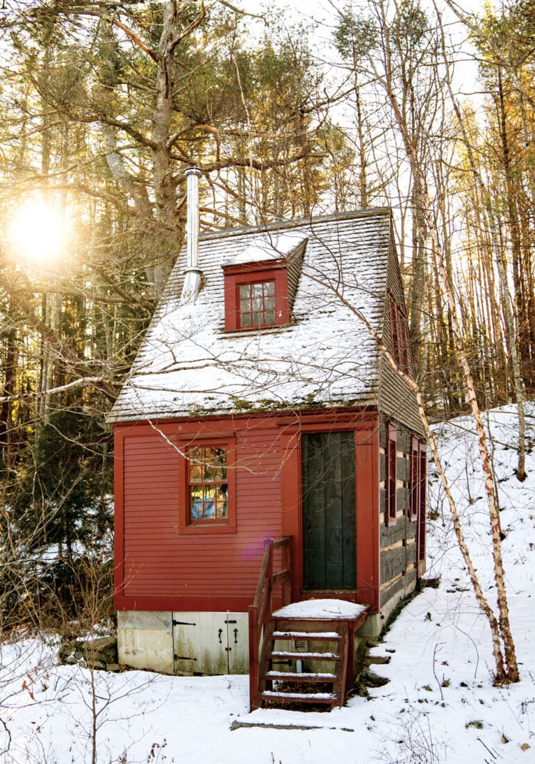 red, snow-covered camp in Alna, Maine