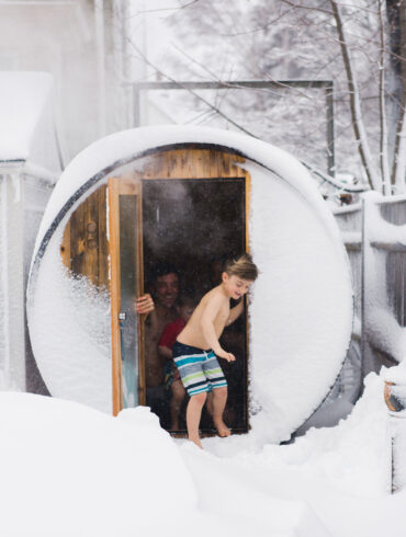 Saer Huston, shown here with sons Riley, 4, and Keller, 7, built the family’s sauna with a kit from Almost Heaven Saunas.