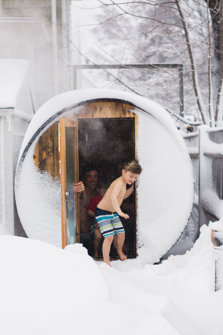 Saer Huston, shown here with sons Riley, 4, and Keller, 7, built the family’s sauna with a kit from Almost Heaven Saunas.