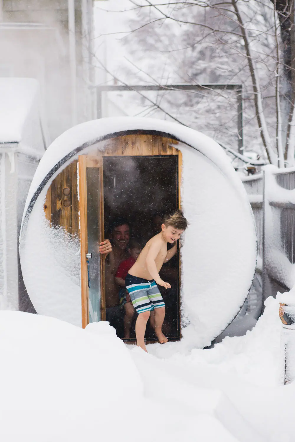 Saer Huston, shown here with sons Riley, 4, and Keller, 7, built the family’s sauna with a kit from Almost Heaven Saunas.