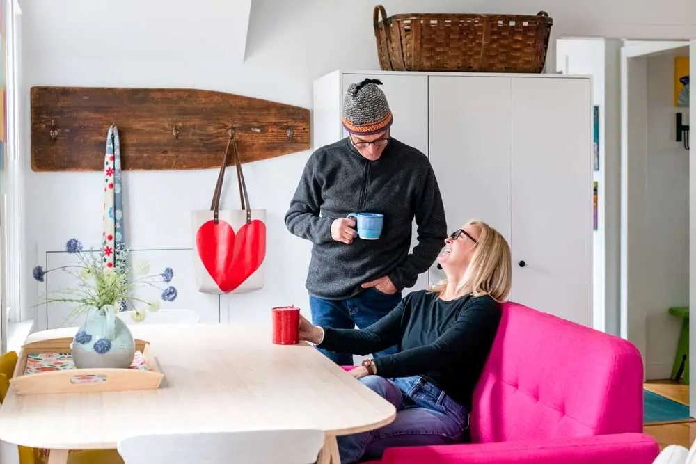 How a House-Flipping Project Became Their Home Mike and Julie Bernier in their South Portland home's dining area