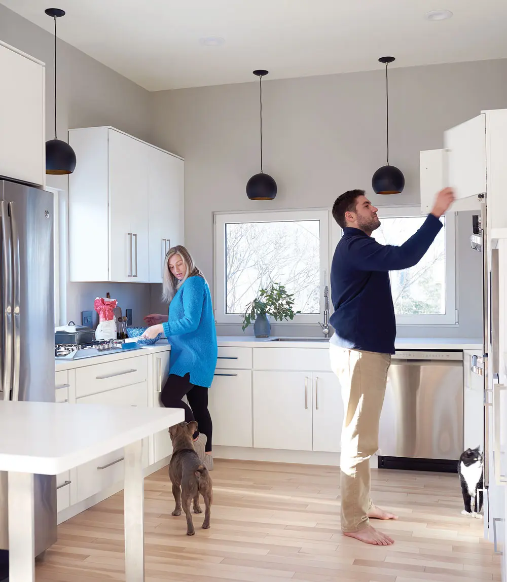 Chairs from Portland’s Chilton and Kennebunkport’s Huston & Company furnish the open kitchen/dining space.