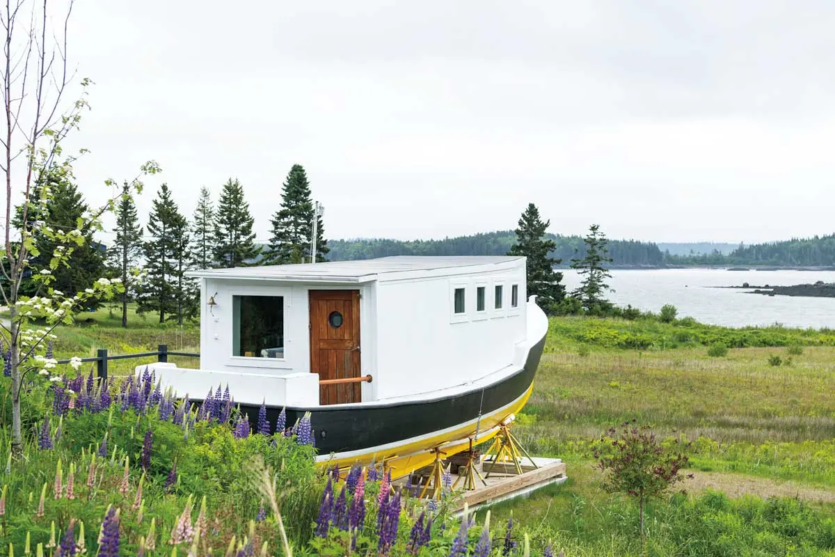 Fall2021_prof1 Julie and Rich Rose’s lobster boat-turned-lounge points toward Holmes Bay.