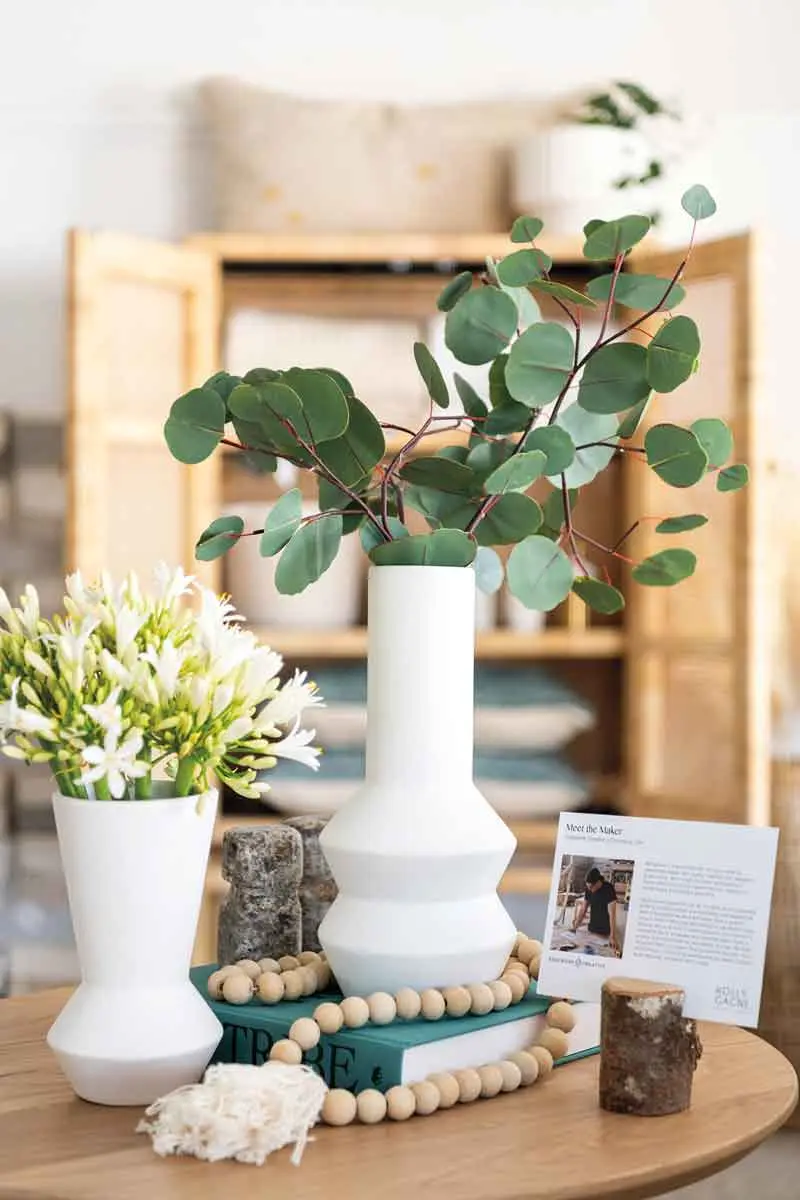 Sculptural vases top an Edgework Creative table