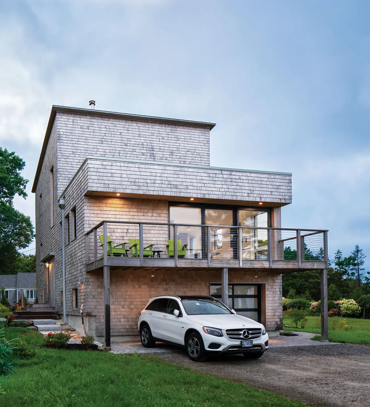 Dreaming of Building a Green Retreat? Stacy Emack and Ed Fels’s Cape Elizabeth home incorporates eastern-white-cedar shingles, a standing- seam metal shed roof, and a PVC flat roof.