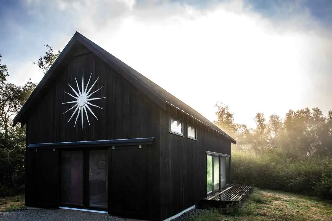 A sunburst, inspired by the work of design icon Tony Duquette, marks the pitch of the barn, the most recent addition to the property.