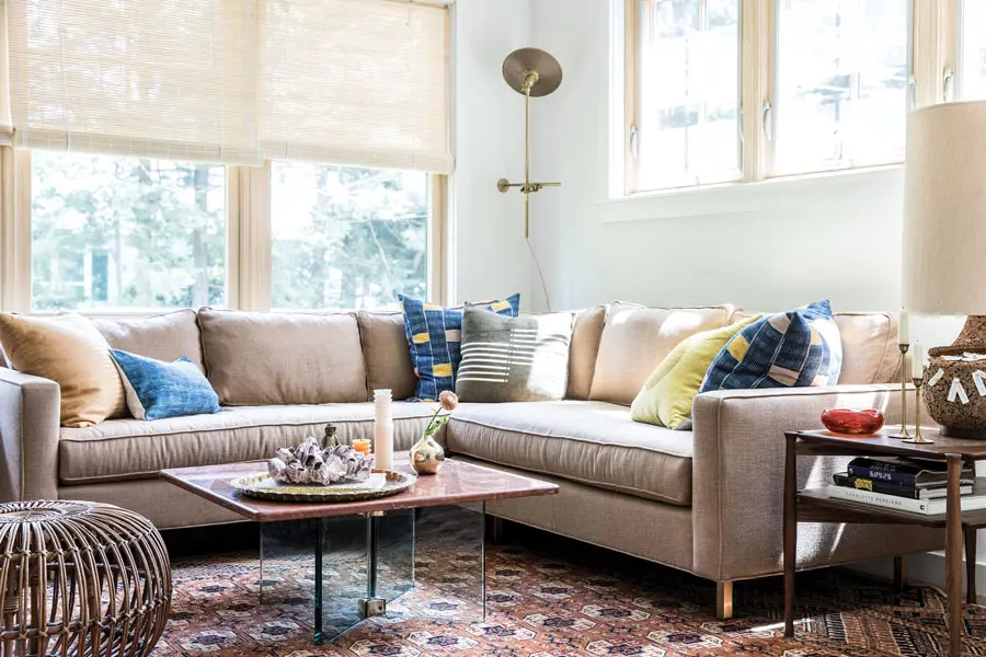 After: A custom sectional from Portland’s Home Remedies hugs a corner of the revamped living room