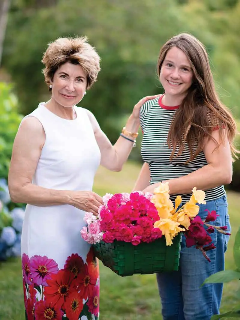 Scores of Colorful Glass Orbs Lend Continuity to This Harpswell Garden the gardens are a collaboration between Atkins, left, and her head gardener, Cathryn Comptois