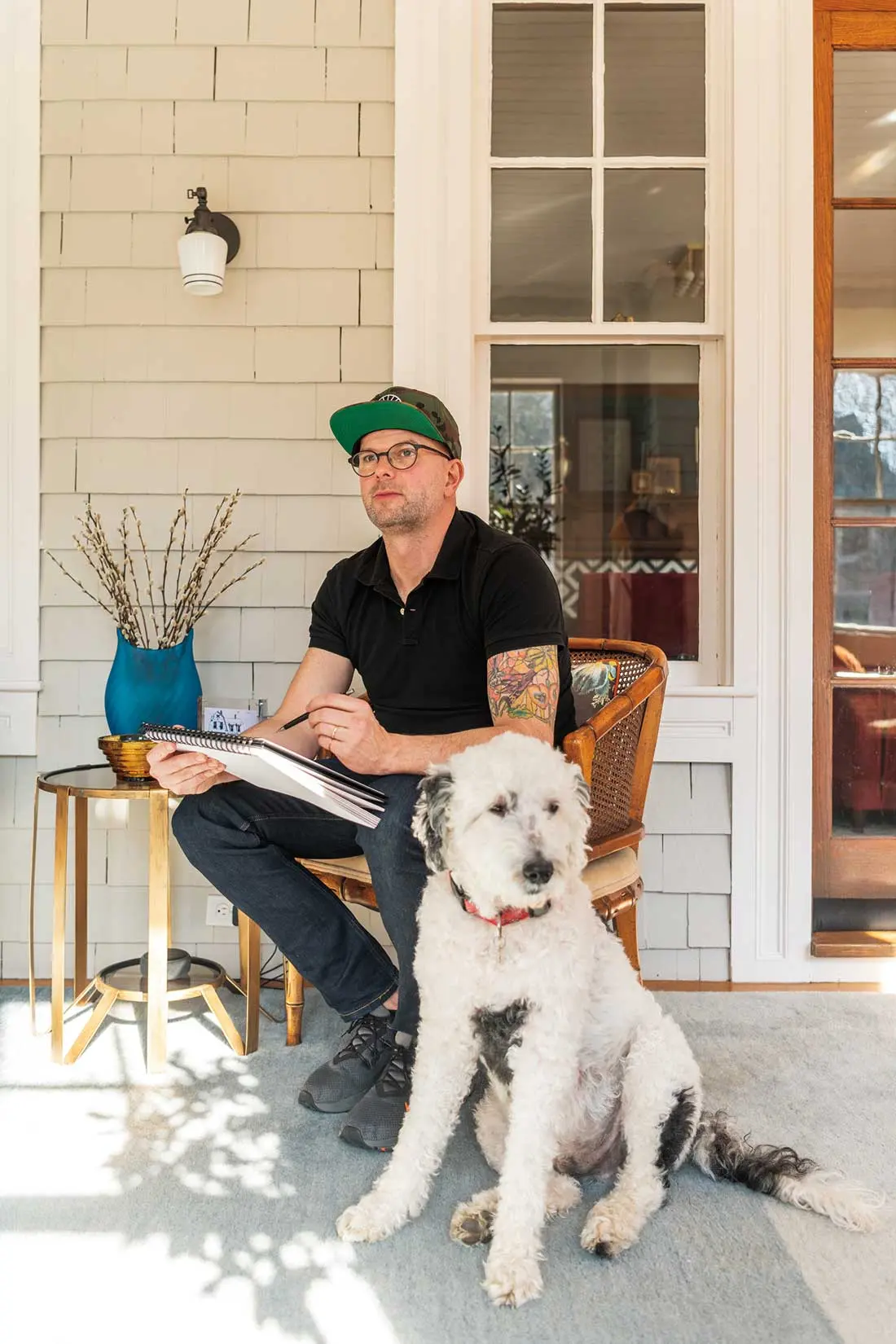 David Duncan Morris sketching on his front porch