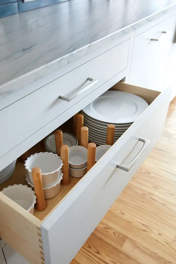 custom greenish-gray kitchen cabinets and drawers