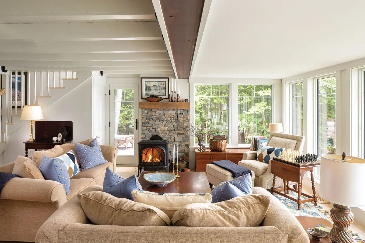 Working with this camp’s existing shape, Rangeley Building & Remodeling annexed a sunroom to create an expanded living space with an exposed steel beam