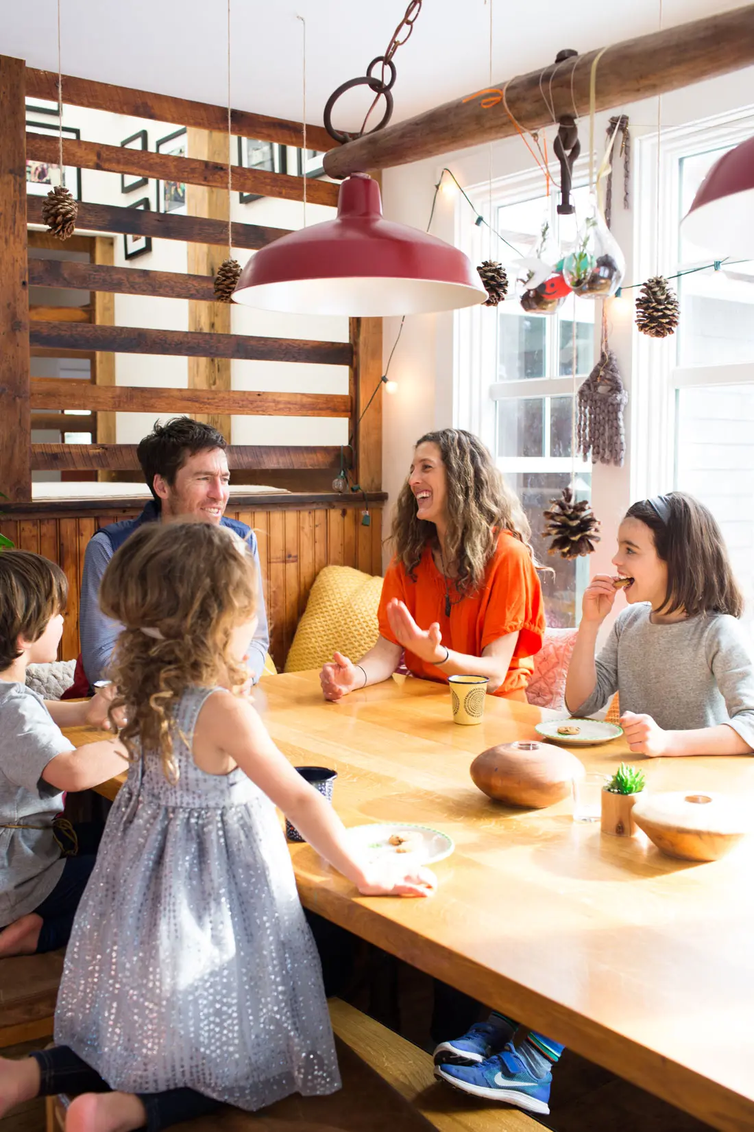 The Strawbridge family gathers around the heirloom-quality, oak Huston & Co. kitchen table in their former South Portland home.