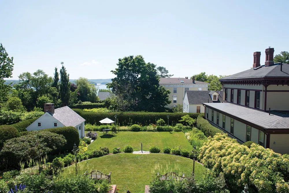 From their home’s second story, the Days can glimpse Castine Harbor beyond their terraced yard.