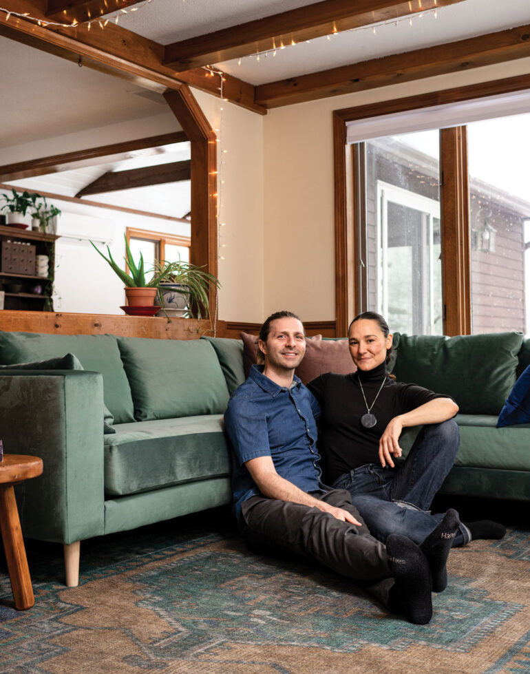 Nick Fuller Googins and his wife, Lize, in the living room of their raised Ranch in Biddeford, Maine