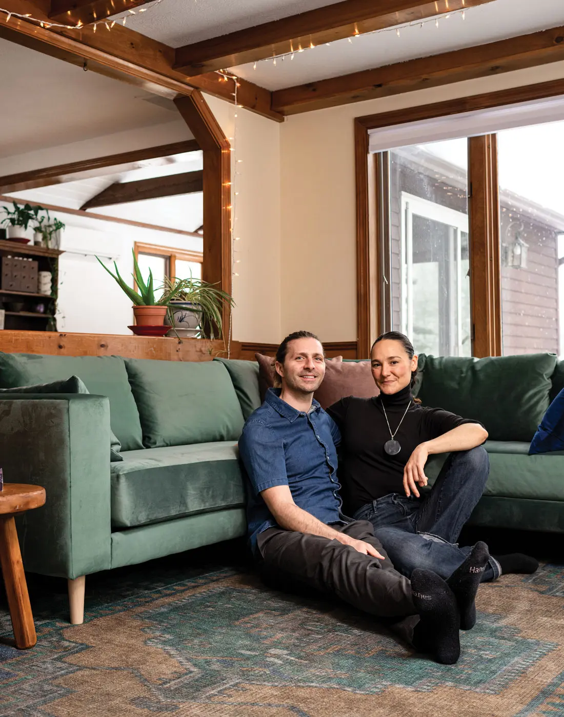 Nick Fuller Googins and his wife, Lize, in the living room of their raised Ranch in Biddeford, Maine
