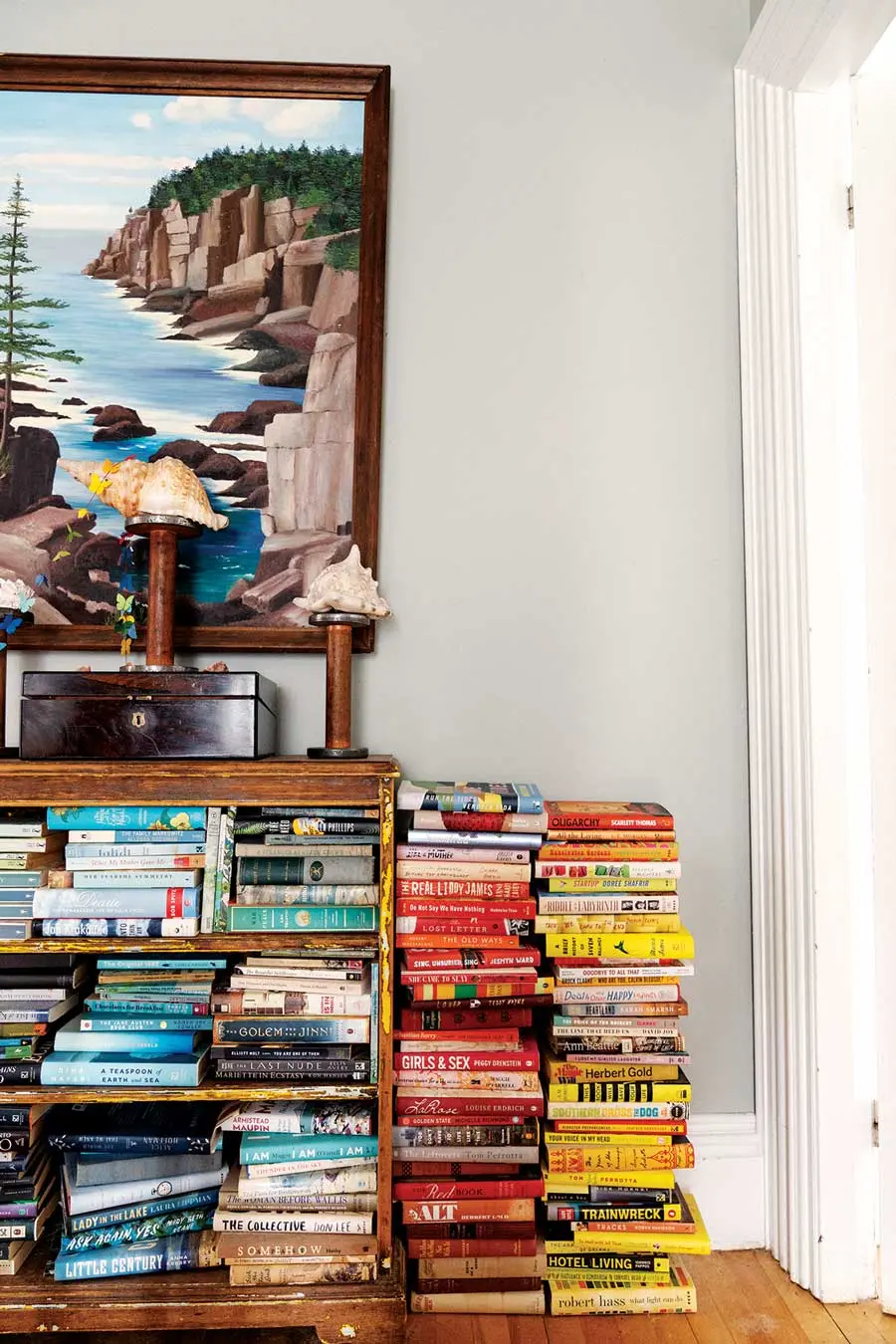 For a Writer and Her Little Brood, a Sprawling Brunswick Home Is the Perfect Fit The house has plenty of room for the author’s many books; the striations in a $15 flea-market painting inspired her to color- code these stacks on the upstairs landing.