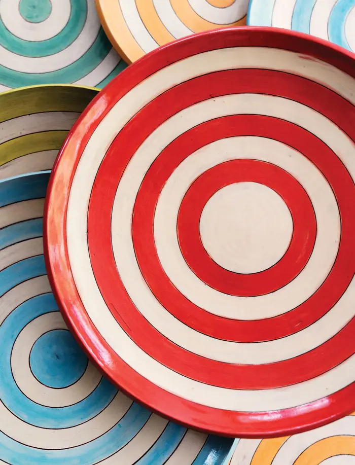 striped, glazed earthenware plates