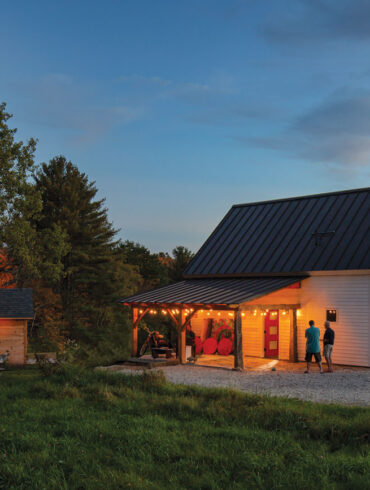 The cherry-red door on Carol Bass and Bob Newton’s Pownal home — equipped with a bronze-colored metal roof and granite patio — hints at the boisterous palette inside.