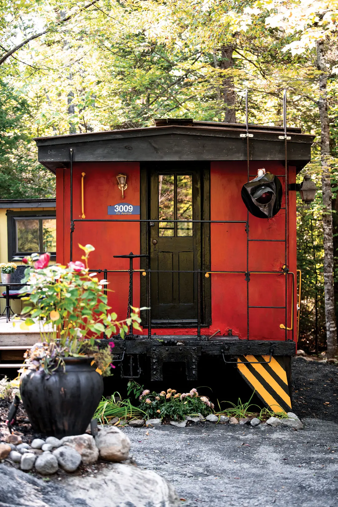 Carrabassett Valley’s Johanna Fowler painted her vintage Maine Central Railroad caboose Benjamin Moore’s Heritage Red as a classic alternative to the car’s original yellow.