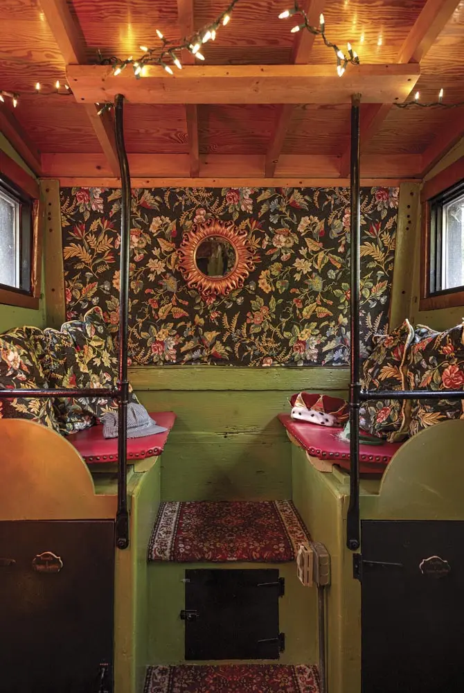 In the cupola, lime-green paint juxtapose red pleather cushions and an accent wall and pillows in floral fabric