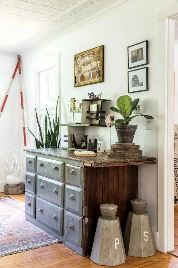 An antique hardware storage chest in the living room.