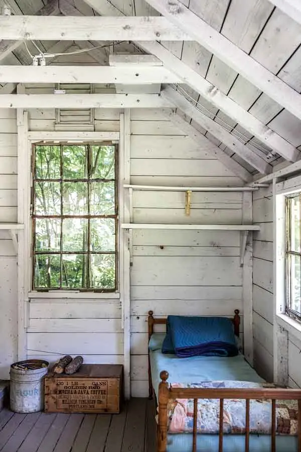 A rustically furnished former chicken coop in the backyard.