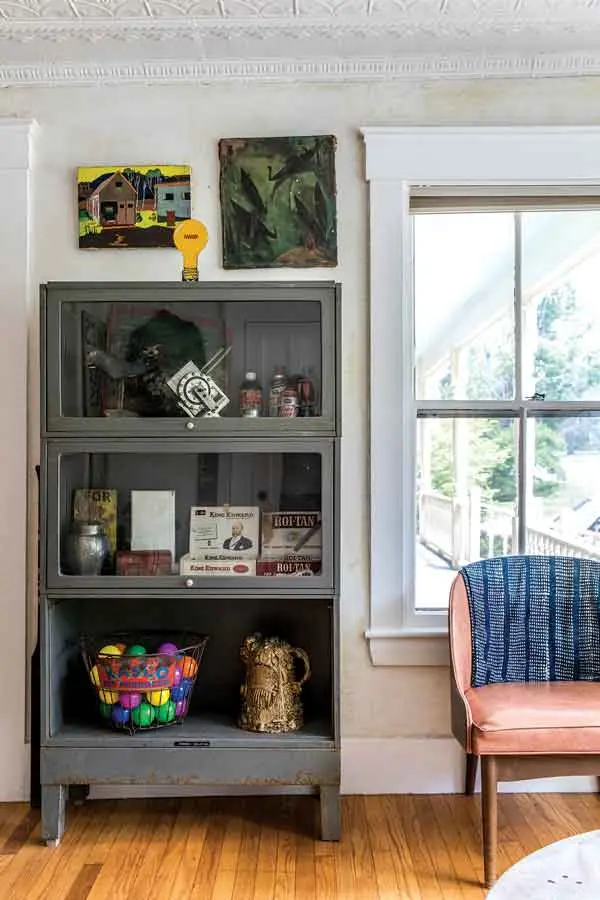 A barrister bookcase repurposed as a living-room curio cabinet.