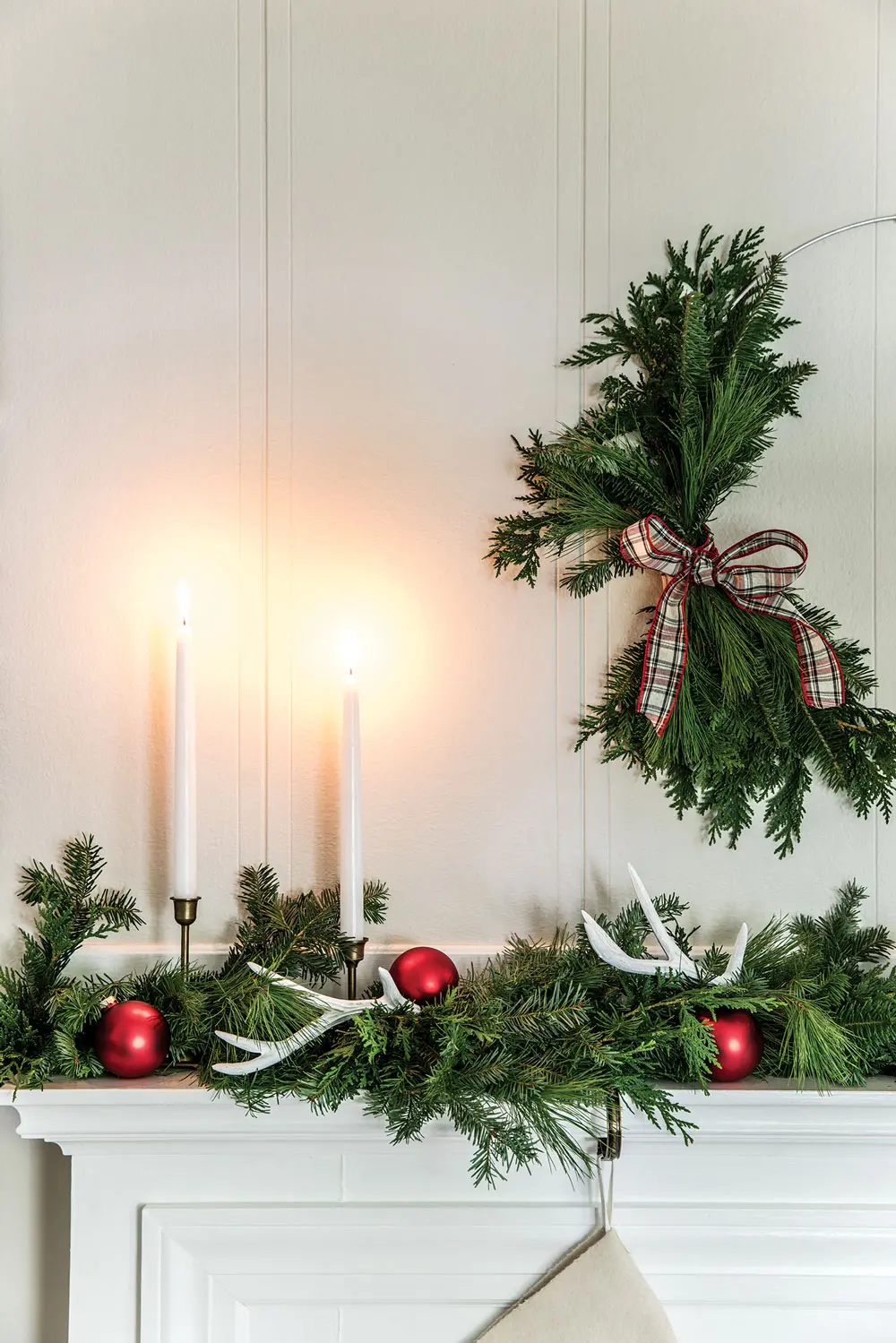 holiday décor ideas, mantel greens, antique candlesticks, and deer antlers