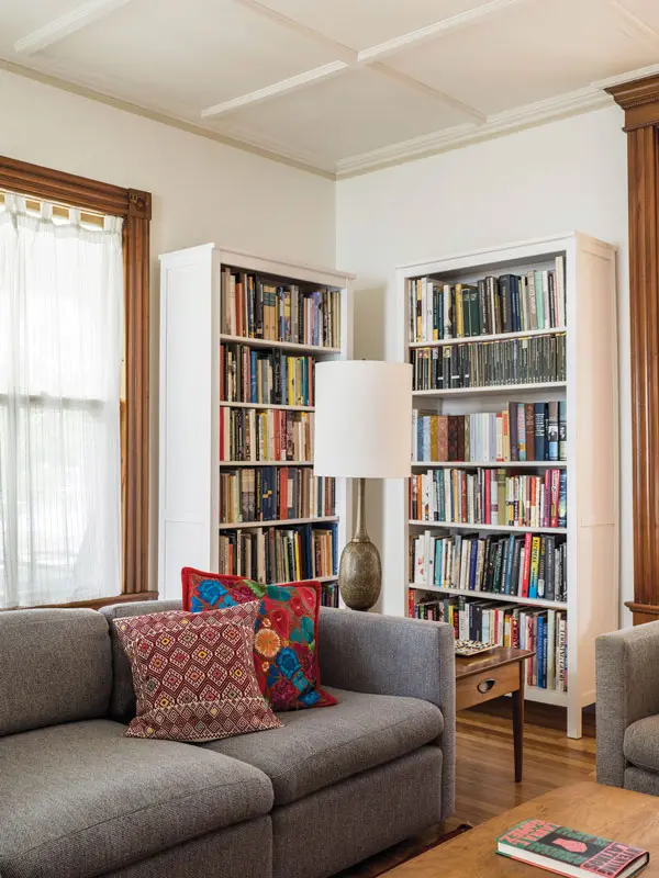 Bookshelves flank the living-room windows