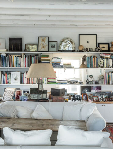 In Sharon and Paul Mrozinski’s collection-packed living room on Vinalhaven, an antique orchard ladder leads to a sleeping loft for their grandchildren.