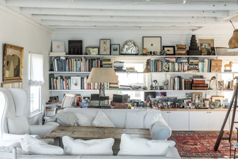 In Sharon and Paul Mrozinski’s collection-packed living room on Vinalhaven, an antique orchard ladder leads to a sleeping loft for their grandchildren.