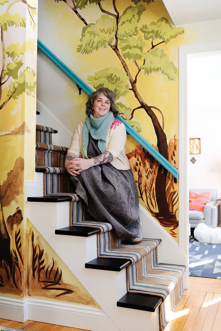 Abigail Gray Swartz and her staircase mural