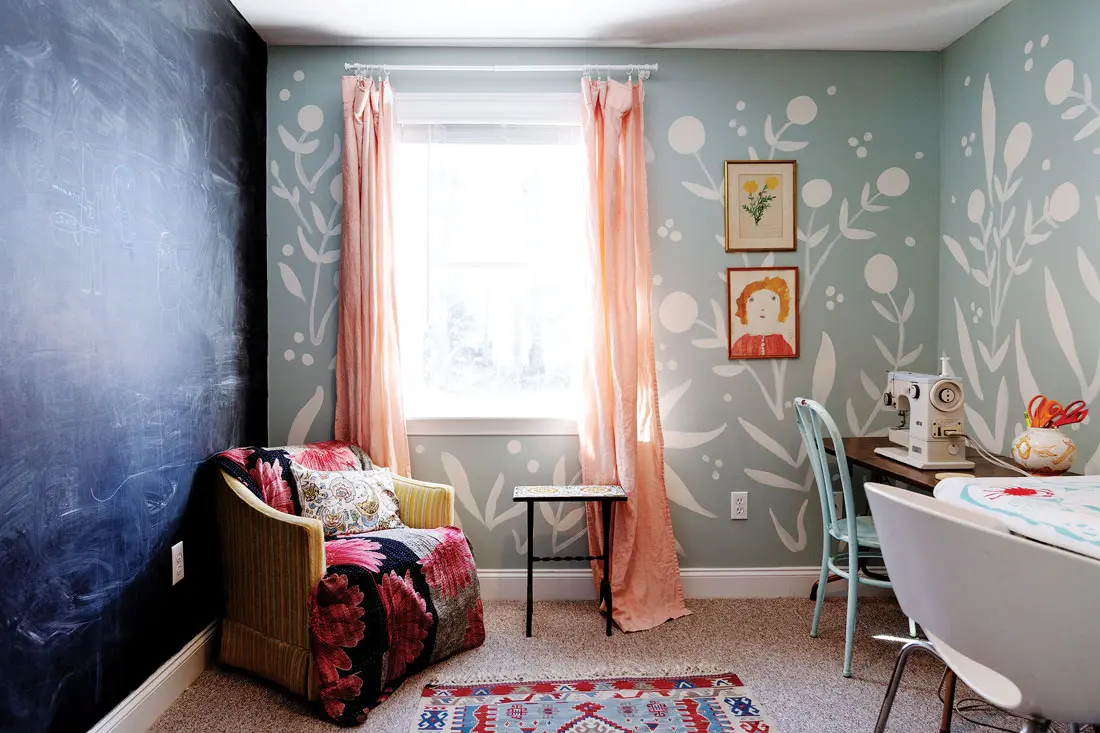 mural of stylized flowers over gray-blue paint by Abigail Gray Swartz