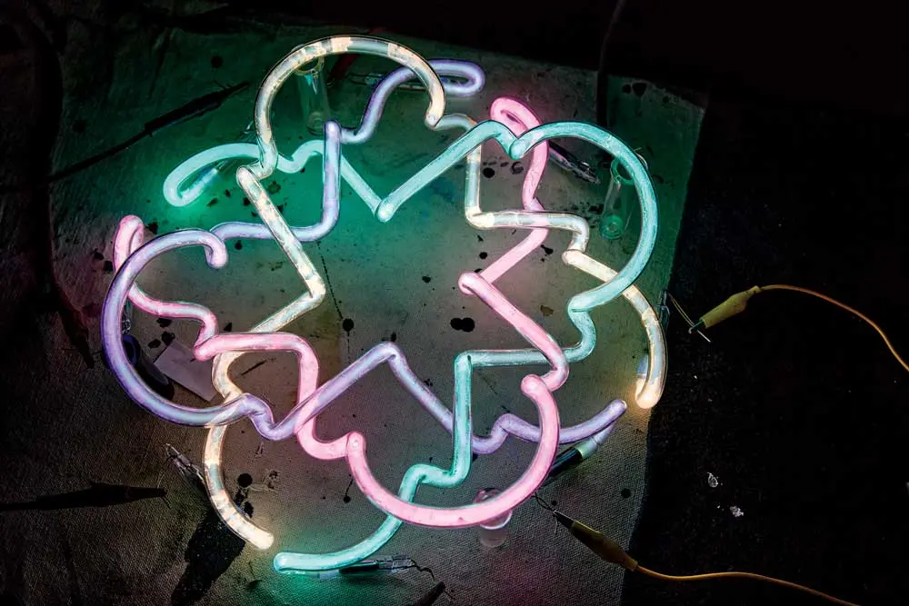 A flower-shaped neon light by Neon Dave, also known as David Johansen