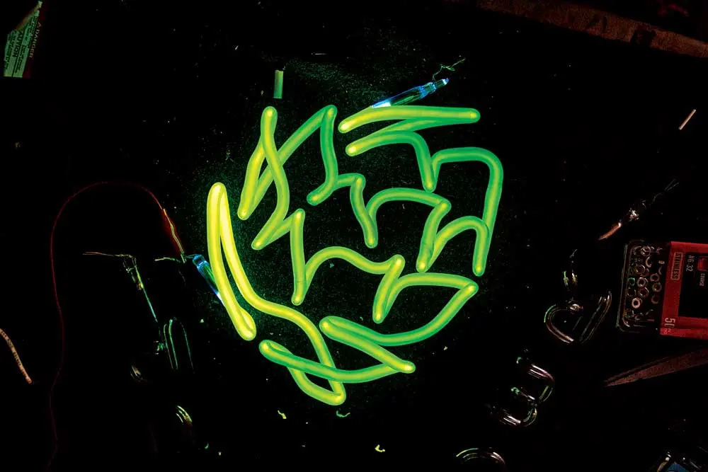 A hop-shaped neon light by Neon Dave, also known as David Johansen