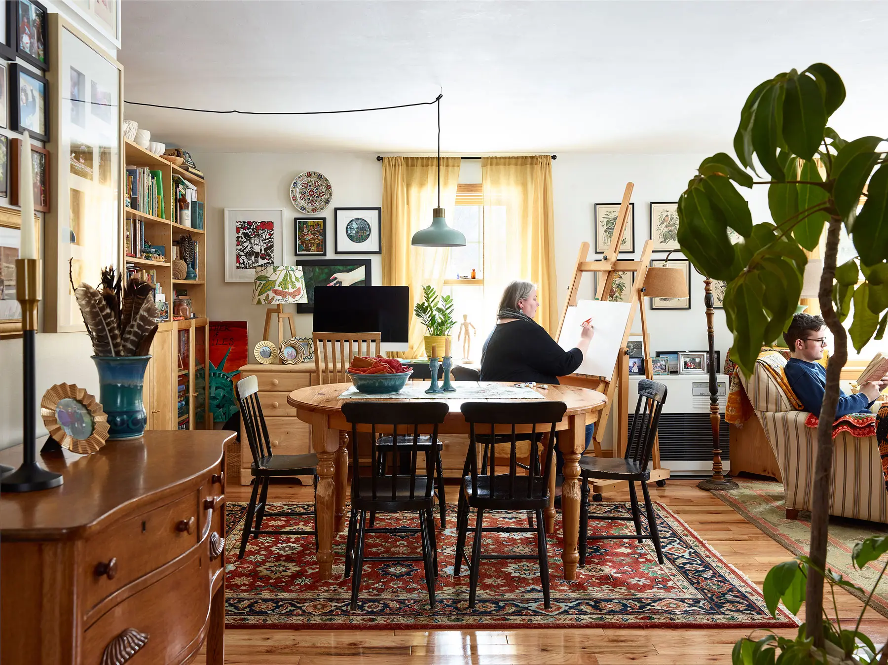 enjoying leisure time in home's living room on Bradstreet Farm