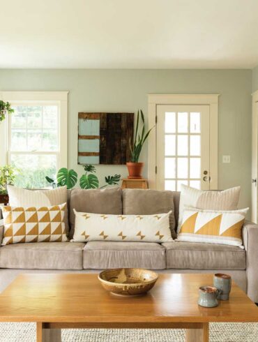A mix of pillows with quilted covers punches up the living-room sofa.