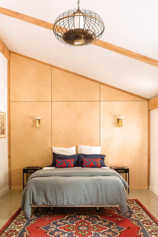 a vintage Oriental from Bradford’s Rug Gallery, in Portland, coordinates with pillows Brunswick’s Cottage Threads Slipcovers stitched with the owners’ vintage barkcloth fabric.