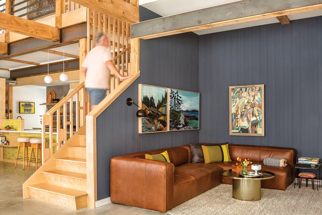Symbiotic oil paintings of the Maine coast, by Portland’s Justine Lasdin, and a 1971 abstract oil decorate the den, which is clad in Weldtex plywood panels in Evening Sky by Benjamin Moore. Wool Normann Copenhagen pillows punctuate a leather sectional from Article.