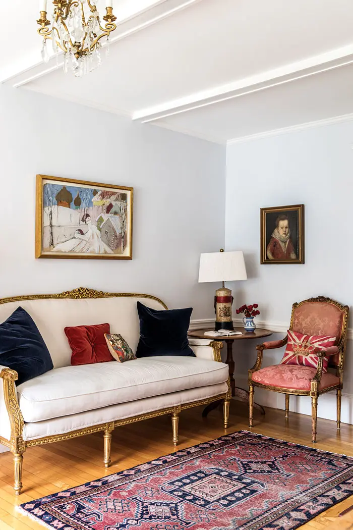 Louis XVI style reigns in the sitting room, in the form of a replica settee from eBay and an antique armchair from Thomaston Place Auction Galleries.