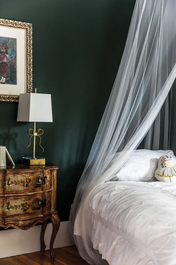 In the Sauers’ eldest daughter Josephine’s room, an antique Florentine nightstand from Pillars in Freeport and a brass Kate Spade lamp feel sophisticated and sweet.
