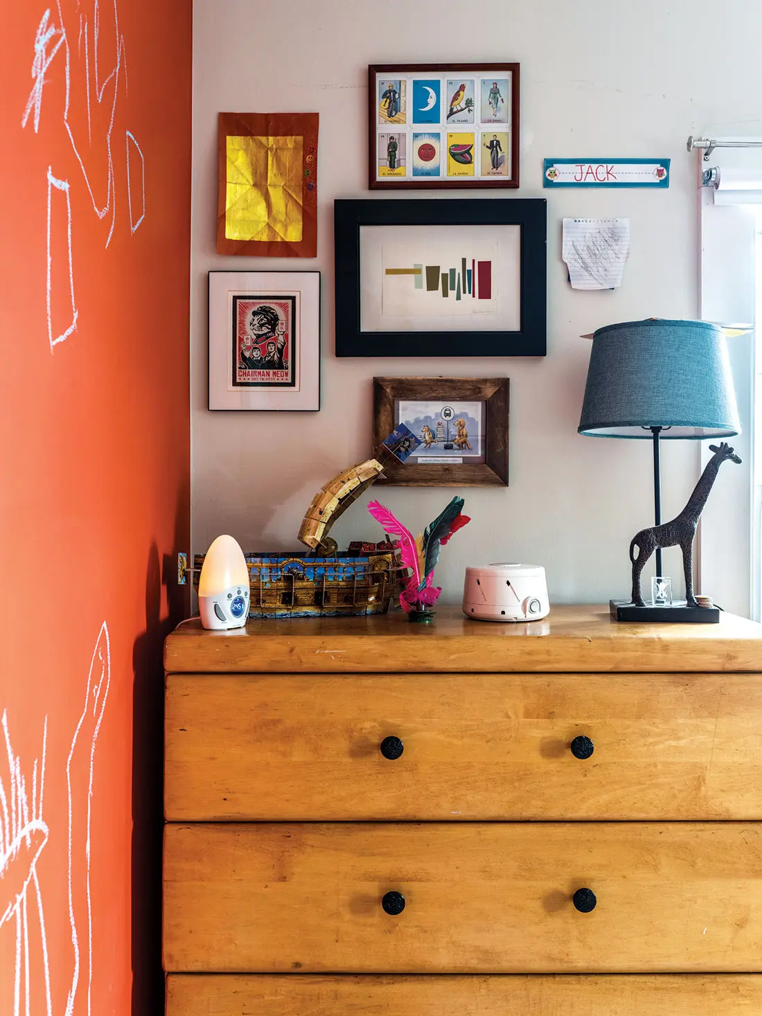 In Jack’s room, a color sketch by Watka, framed Mexican playing cards, and his own art crown Halchak’s childhood bureau.