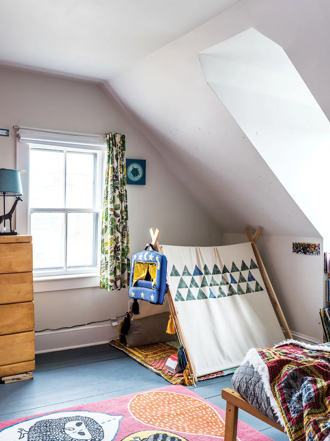 A grandma-made tent pairs with curtains stitched from leafy IKEA fabric in Jack’s room.