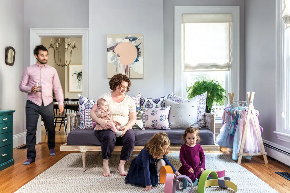 the living room of a renovated triple-decker Victorian in Portland Maine