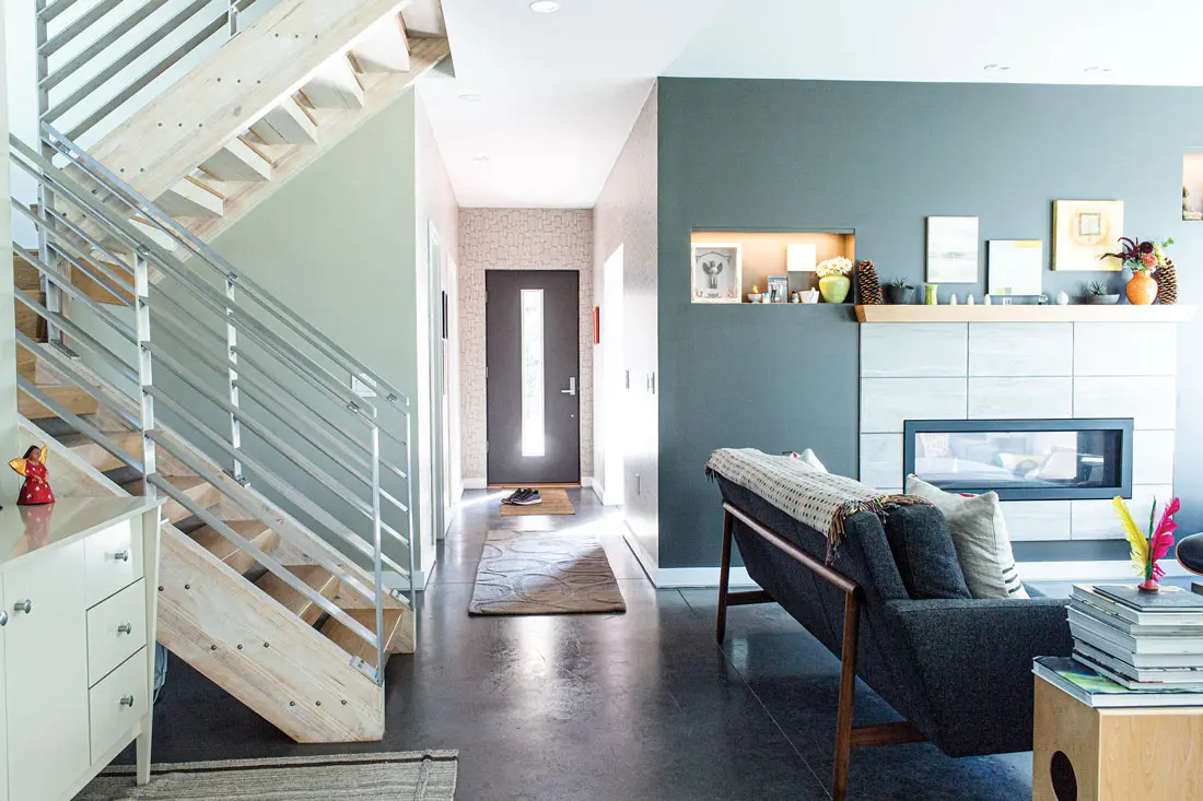 Dreaming of Building a Green Retreat? Brunswick builder Matt Senecal worked with Pownal’s Bradbury Mountain Metalworks to customize the maple living room staircase.